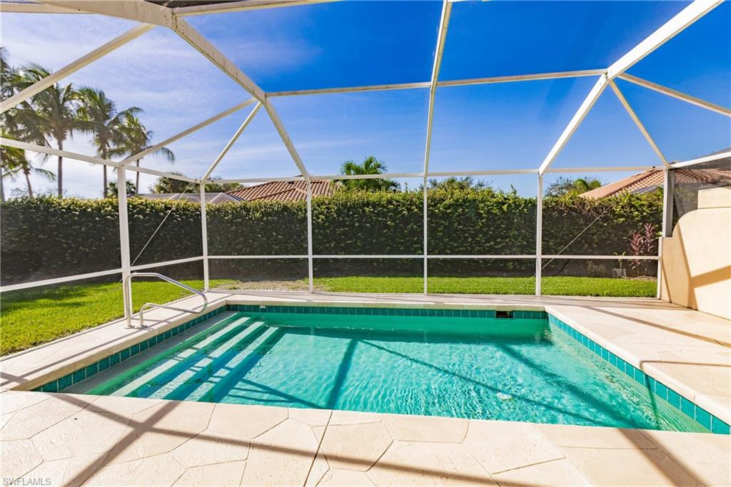 4113 Tabago Lane Naples, FL 34119 - Photo 2 of 50 View of swimming pool with a lanai and a patio
