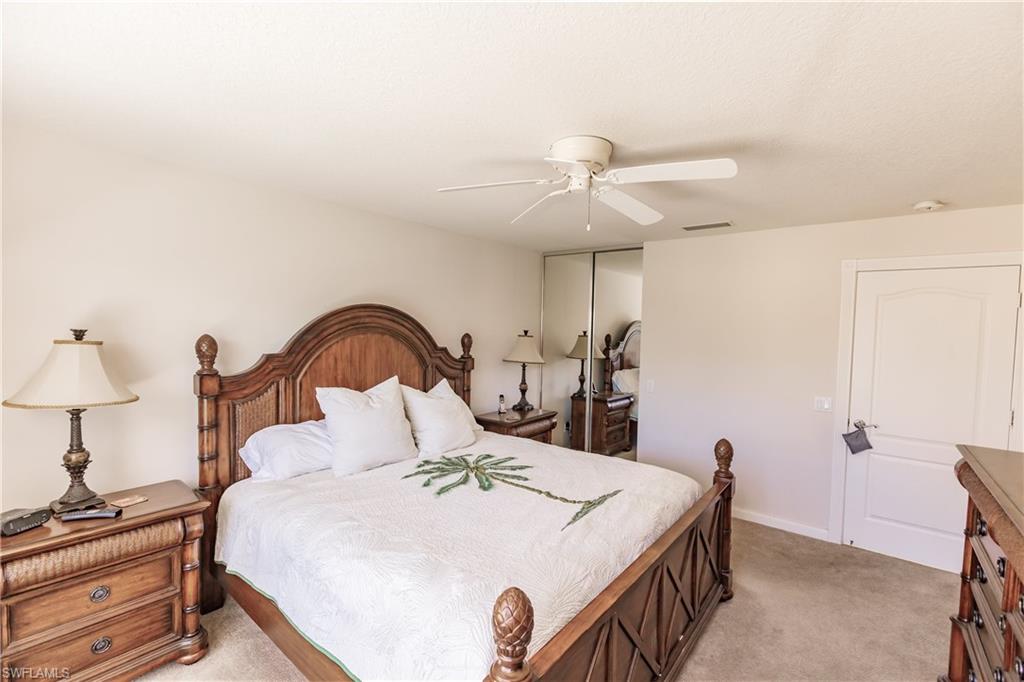 4113 Tabago Lane Naples, FL 34119 - Photo 24 of 50 Carpeted bedroom with ceiling fan and a closet