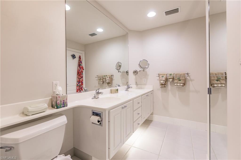 4113 Tabago Lane Naples, FL 34119 - Photo 26 of 50 Bathroom featuring tile patterned floors, vanity, and toilet