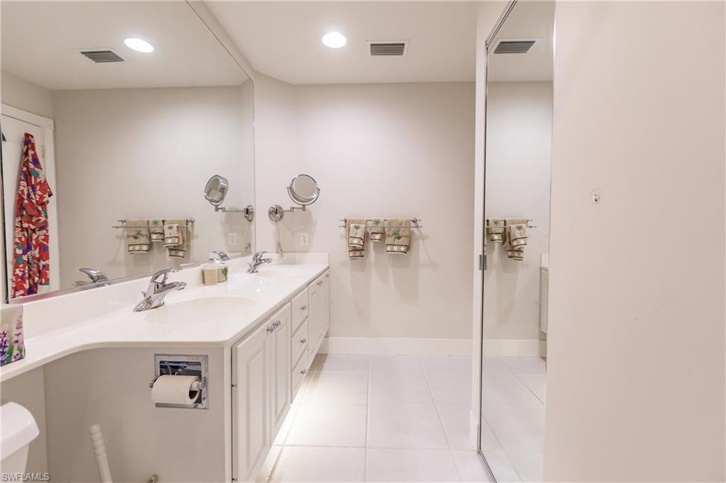4113 Tabago Lane Naples, FL 34119 - Photo 32 of 50 Bathroom featuring tile patterned floors and vanity