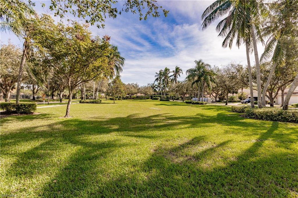 4113 Tabago Lane Naples, FL 34119 - Photo 41 of 50 Surrounding community featuring a lawn