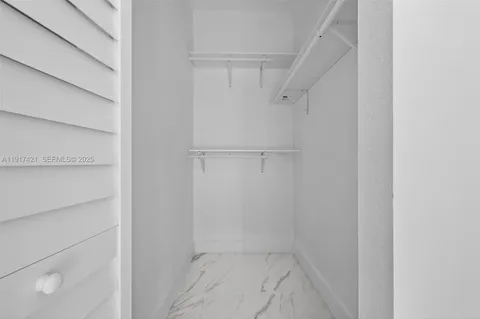 a view of an empty walk in closet