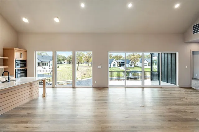 a view of an entryway with wooden floor