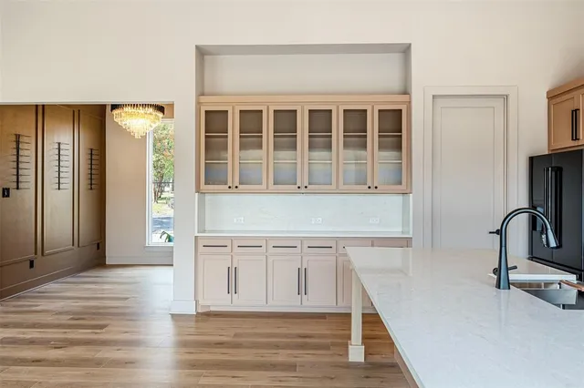 a view of a kitchen with a sink and cabinets