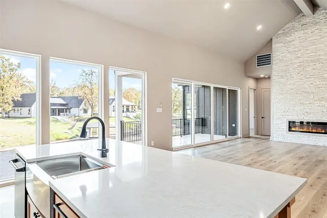 a kitchen with granite countertop a sink and a counter top space