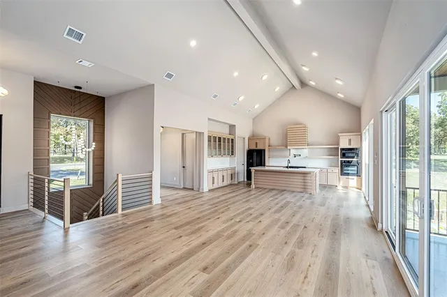 a view of kitchen with cabinets and wooden floor