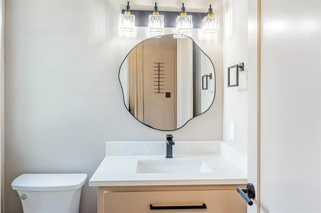 a bathroom with a sink and mirror
