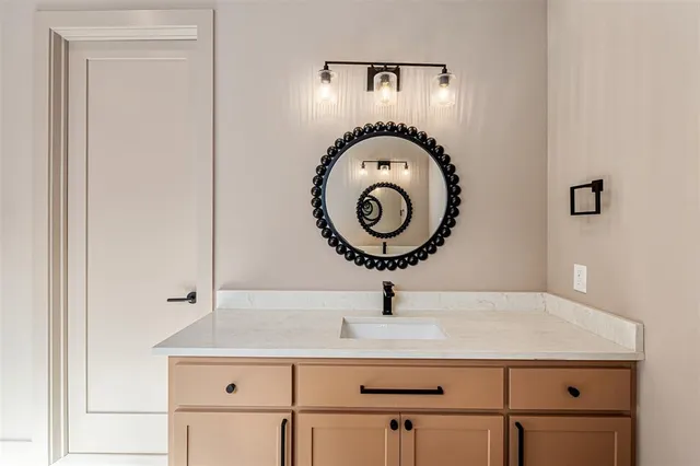 a close view of light fixtures and washer in a kitchen
