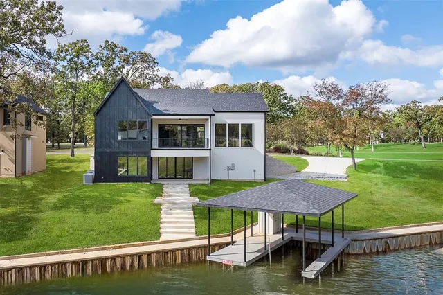 a view of a house with a yard from a patio