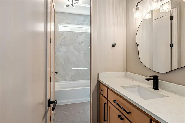 a bathroom with a sink double vanity and a mirror