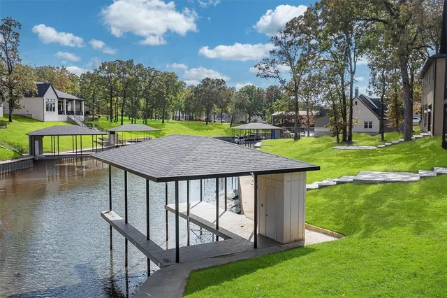 a view of a swimming pool with a patio and a yard