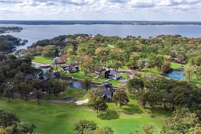 a view of a garden with lawn chairs