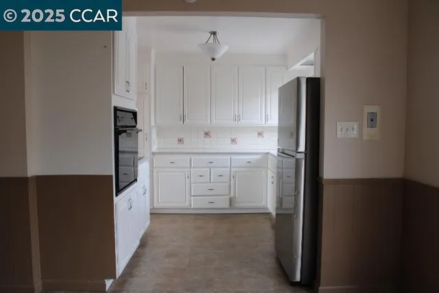 a view of cabinets with wooden floor
