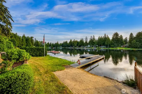 a view of a lake with houses in the back