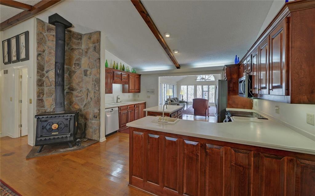 290 Waterfall Drive Cleveland, GA 30528 - Photo 17 of 46 a kitchen with sink a refrigerator and cabinets