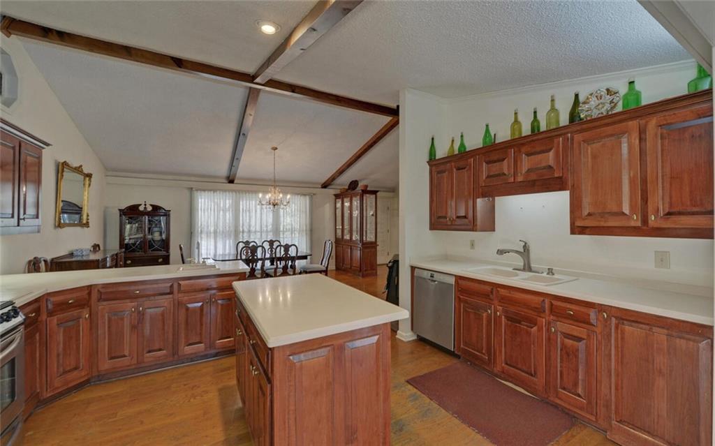 290 Waterfall Drive Cleveland, GA 30528 - Photo 19 of 46 a kitchen with wooden cabinets and sink