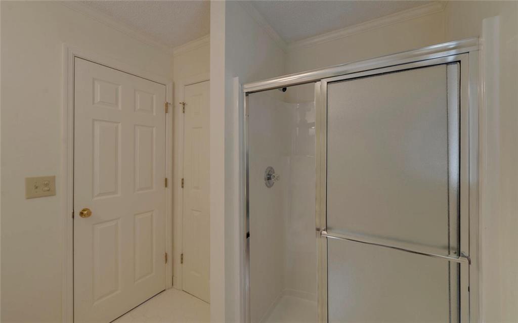 290 Waterfall Drive Cleveland, GA 30528 - Photo 24 of 46 a bathroom with a glass shower door
