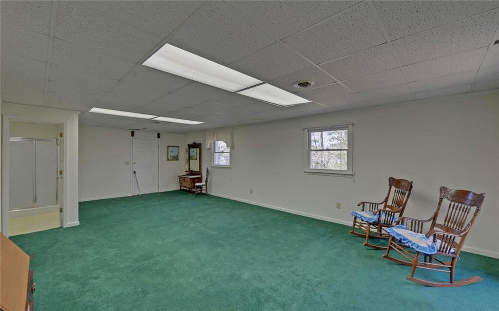 290 Waterfall Drive Cleveland, GA 30528 - Photo 37 of 46 a view of a room with a chair and table window