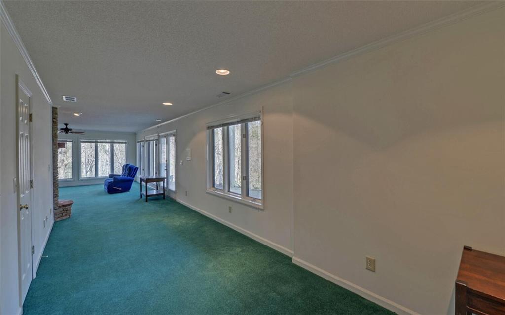 290 Waterfall Drive Cleveland, GA 30528 - Photo 39 of 46 a view of a livingroom with wooden floor and a window