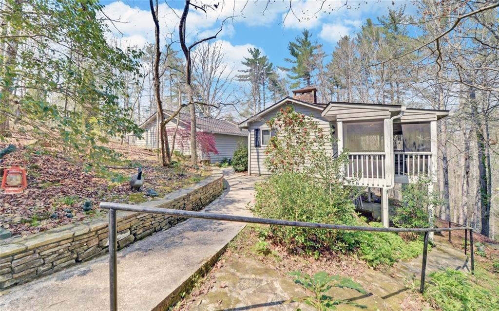 290 Waterfall Drive Cleveland, GA 30528 - Photo 4 of 46 a front view of a house with garden