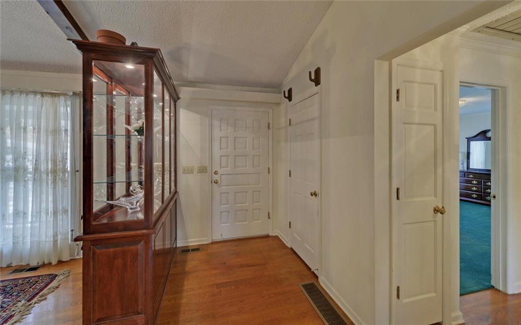 290 Waterfall Drive Cleveland, GA 30528 - Photo 6 of 46 a view of a hallway with wooden floor and closet area
