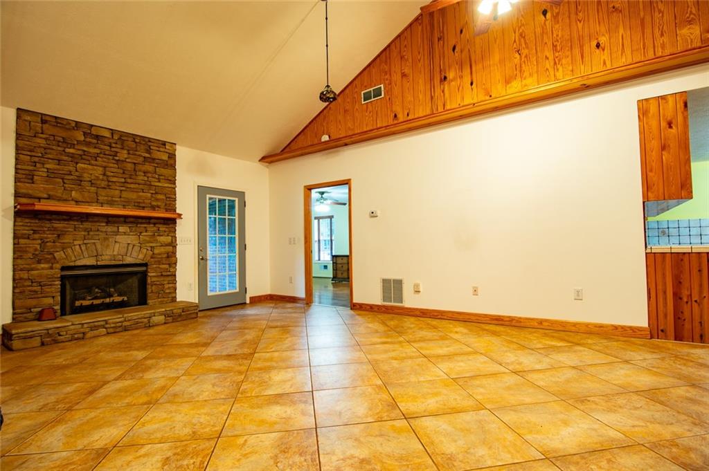 360 Parr Farm Road Covington, GA 30016 - Photo 19 of 74 a view of empty room with wooden floor and fireplace