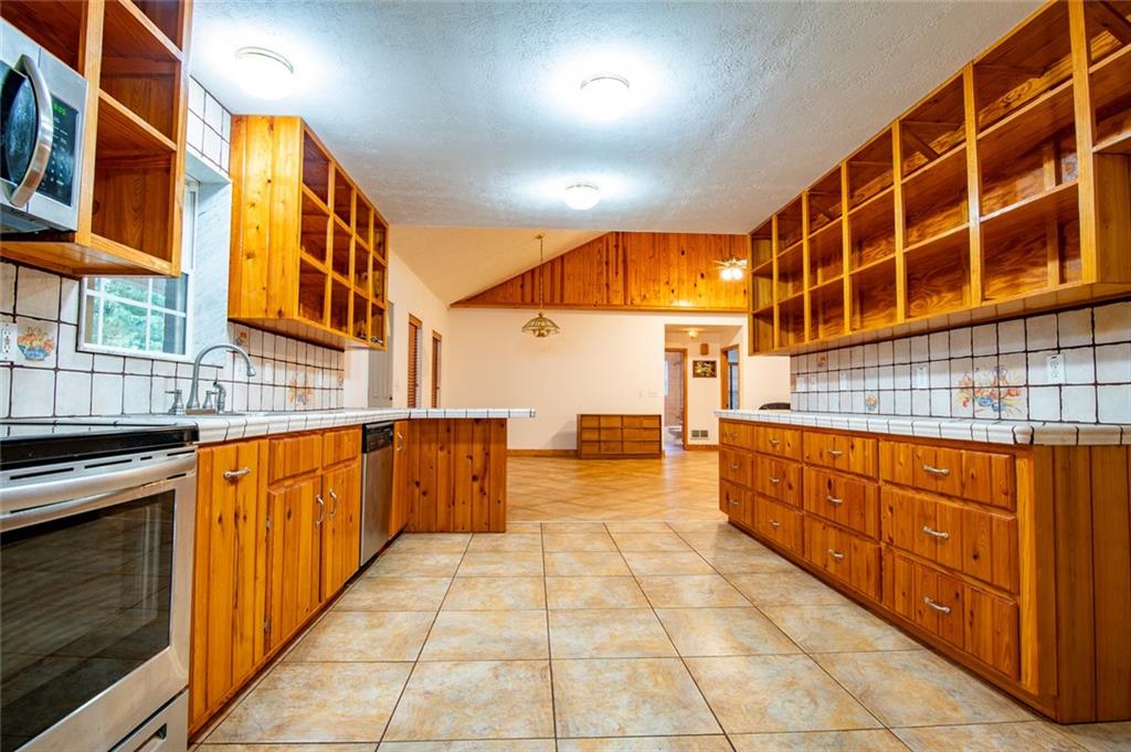 360 Parr Farm Road Covington, GA 30016 - Photo 28 of 74 a view of a kitchen with a barbeque grill and cabinets