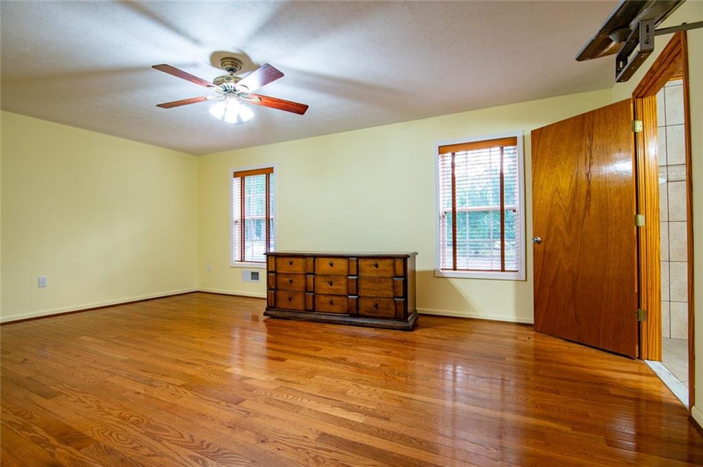 360 Parr Farm Road Covington, GA 30016 - Photo 31 of 74 an empty room with ceiling fan and window