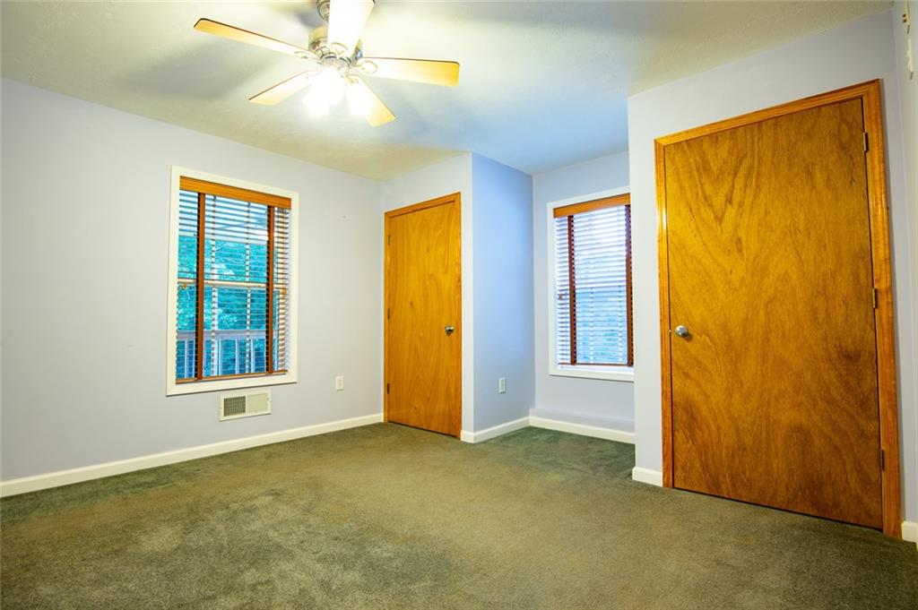 360 Parr Farm Road Covington, GA 30016 - Photo 39 of 74 an empty room with windows and closet area