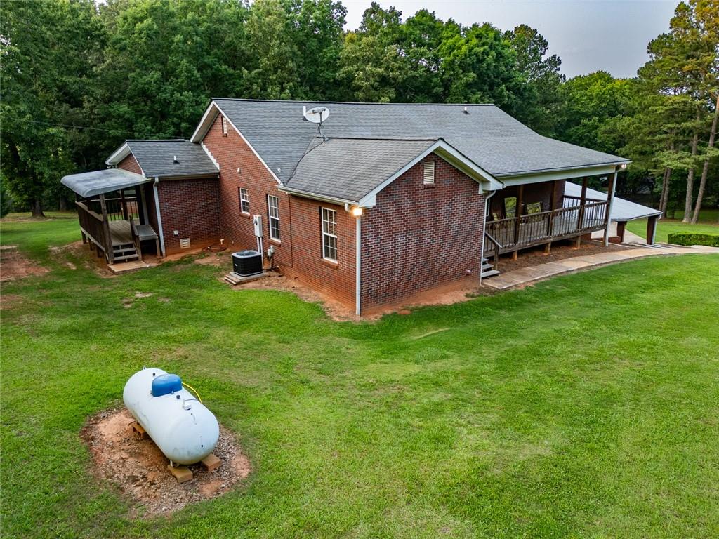 360 Parr Farm Road Covington, GA 30016 - Photo 68 of 74 a aerial view of a house with a yard table and chairs