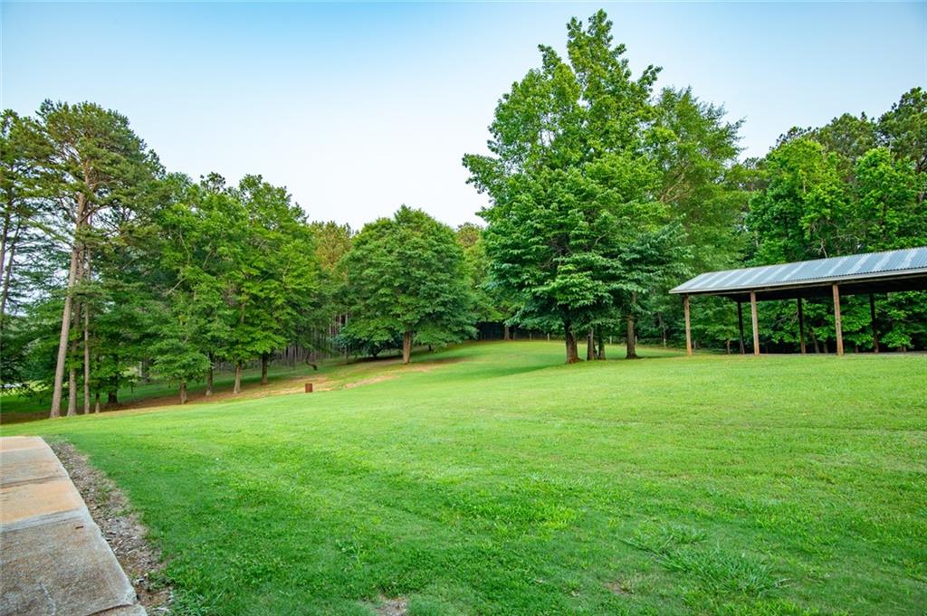 360 Parr Farm Road Covington, GA 30016 - Photo 8 of 74 a view of a grassy field with trees in the background