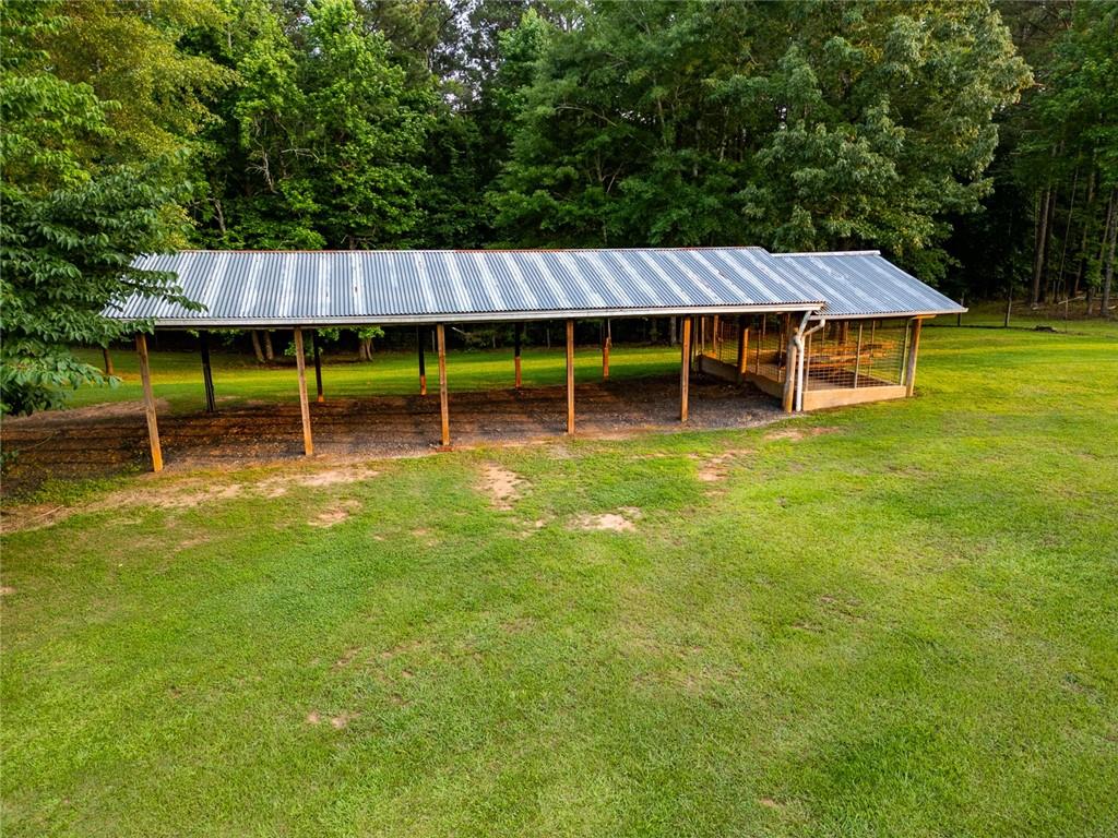 360 Parr Farm Road Covington, GA 30016 - Photo 10 of 74 a backyard of a house with wooden fence and a bench