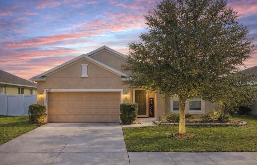 front view of a house with a yard
