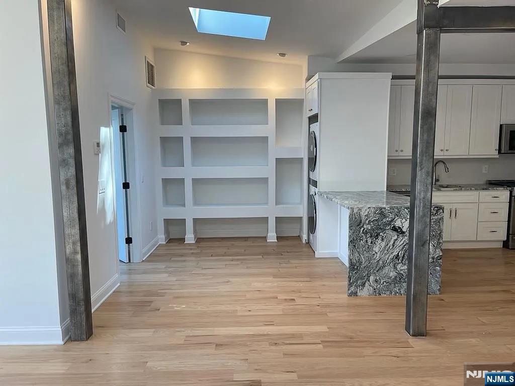 9009 Riverside Place, Unit 2 North Bergen, NJ 07047 - Photo 4 of 14 a room with closet and a rug