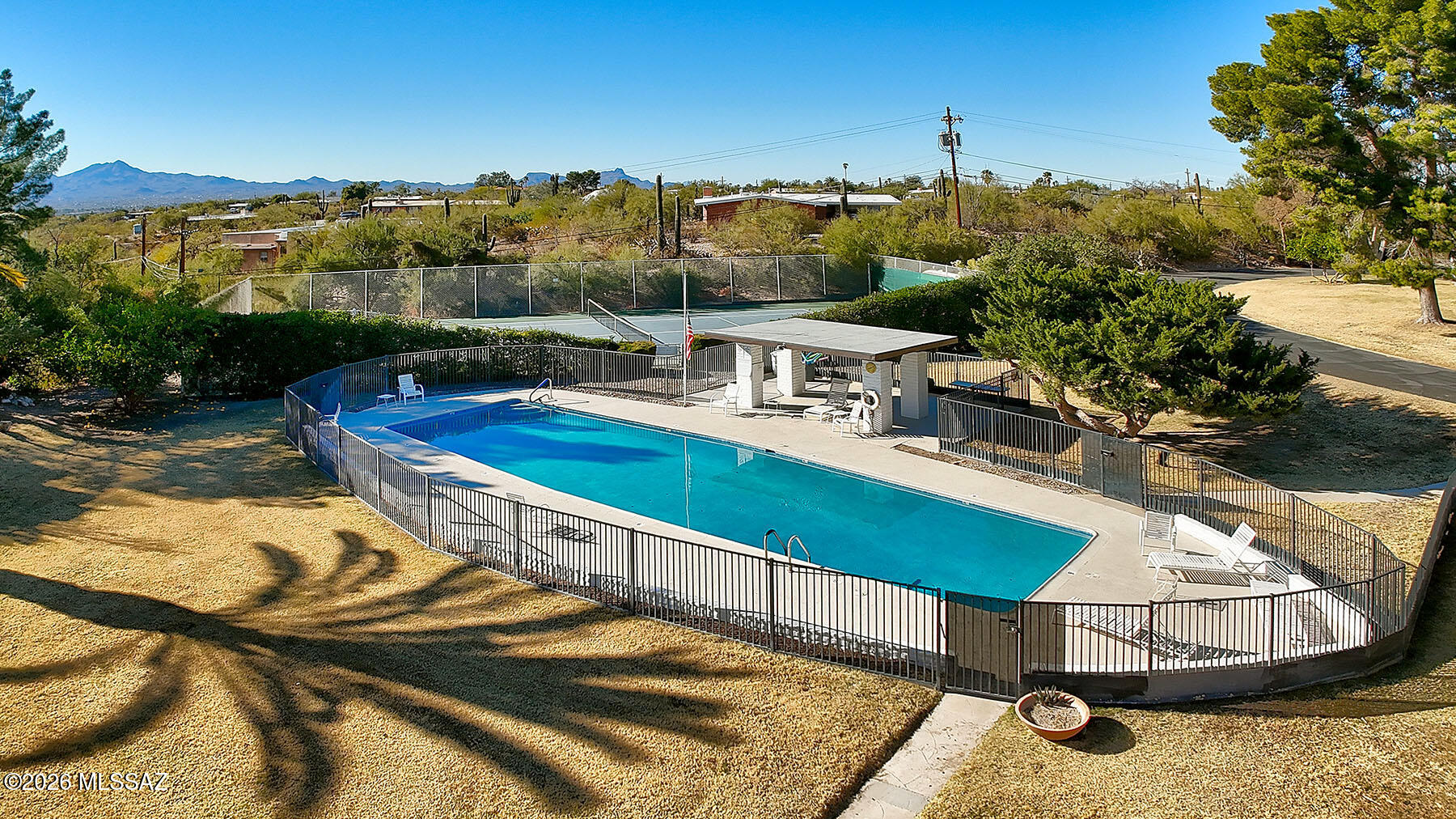 719 West Las Lomitas Road Tucson, AZ 85704 - Photo 40 of 44 a view of a swimming pool with an outdoor seating and a mountain view