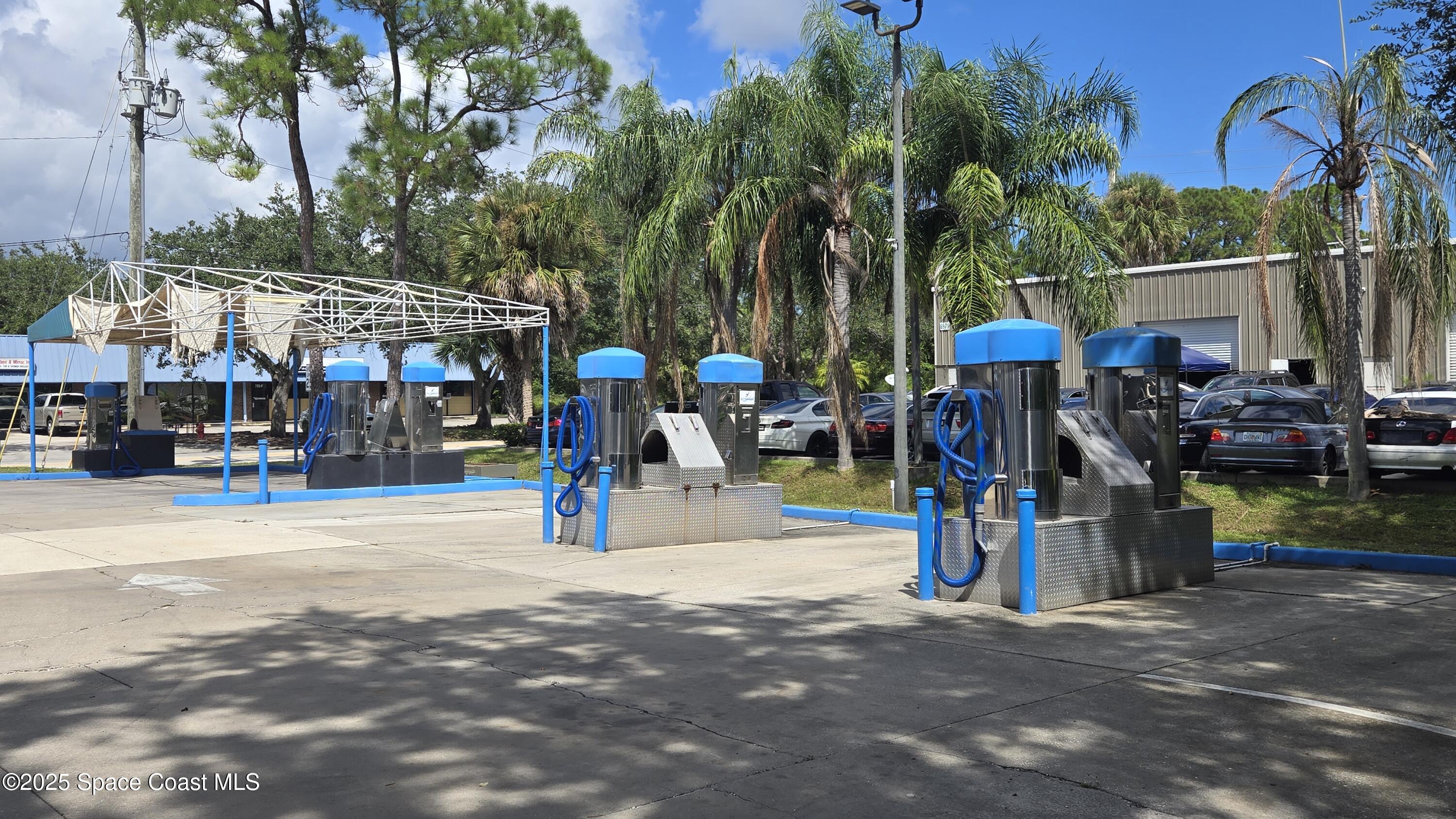 745 South Wickham Road West Melbourne, FL 32904 - Photo 11 of 67 a view of street with sitting area