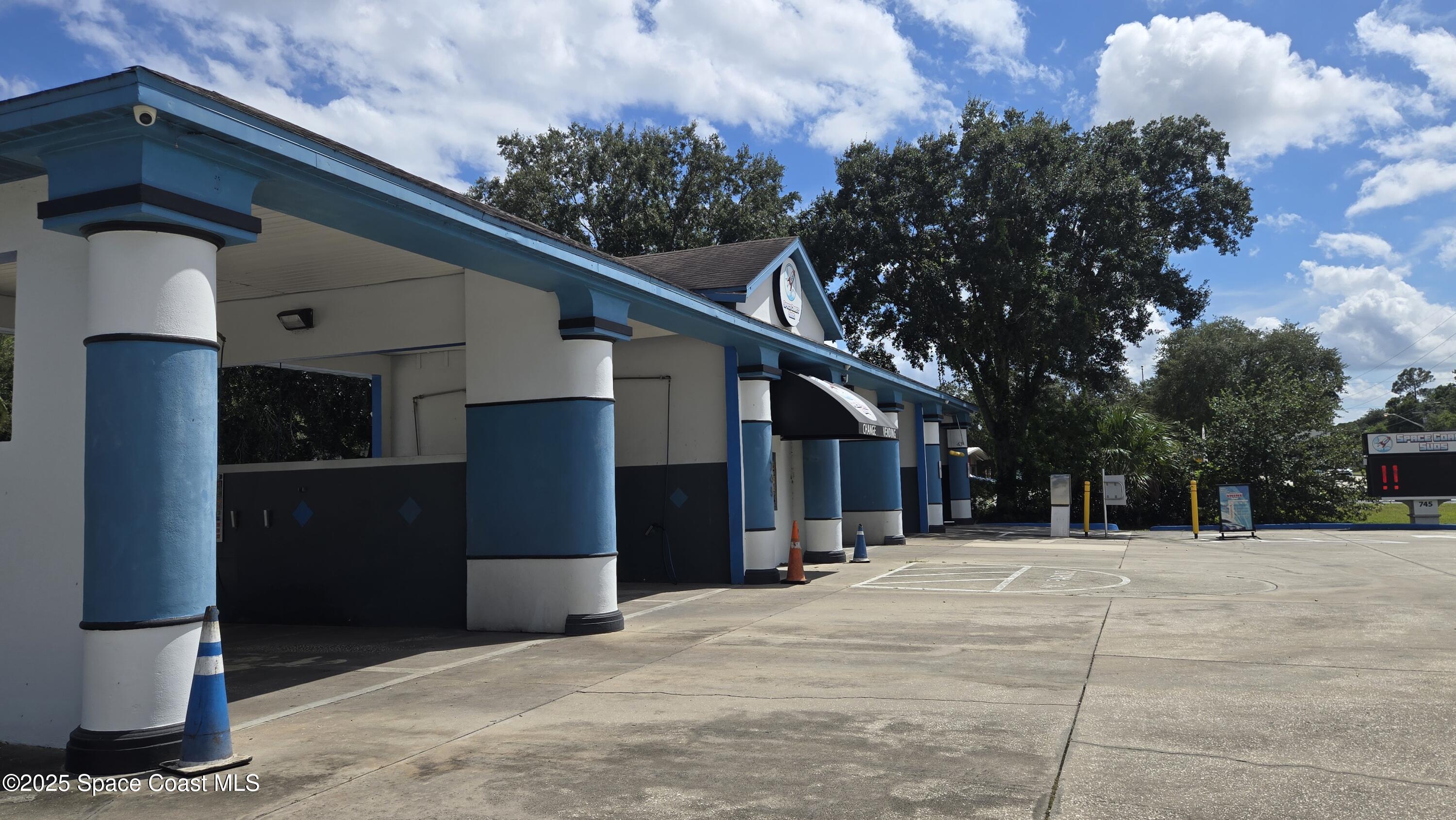 745 South Wickham Road West Melbourne, FL 32904 - Photo 13 of 67 a front view of a house with a yard