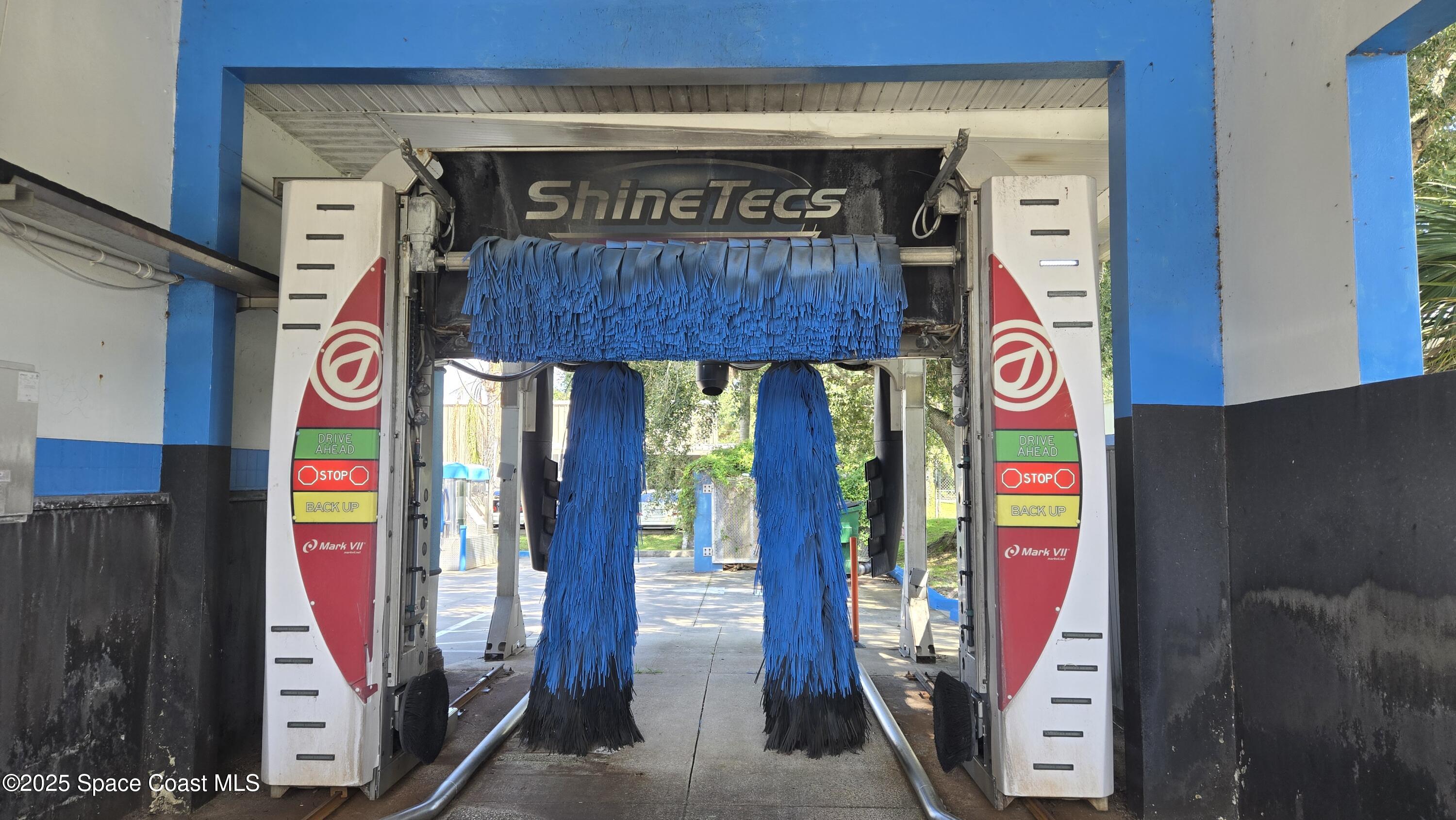 745 South Wickham Road West Melbourne, FL 32904 - Photo 14 of 67 a sign board with parking