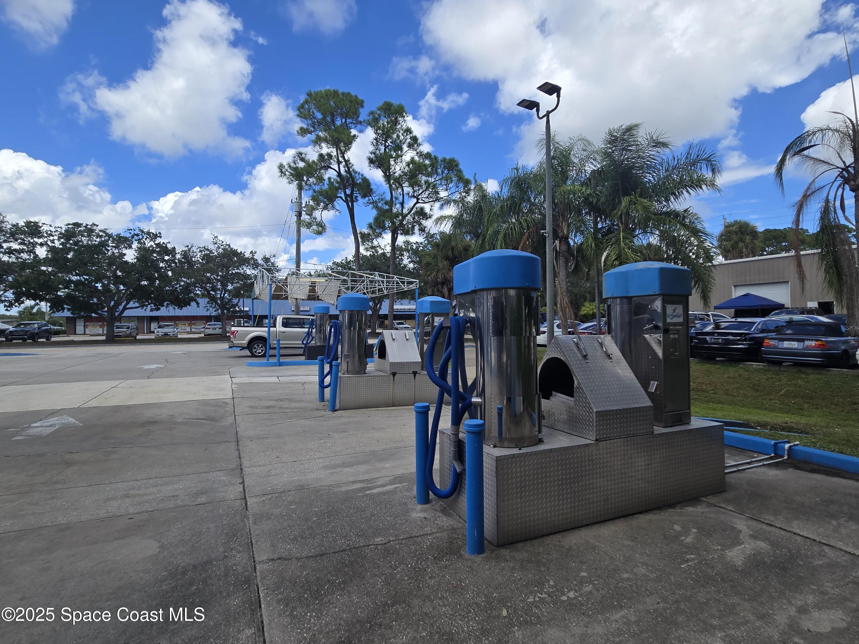 745 South Wickham Road West Melbourne, FL 32904 - Photo 21 of 67 a view of street with sitting area