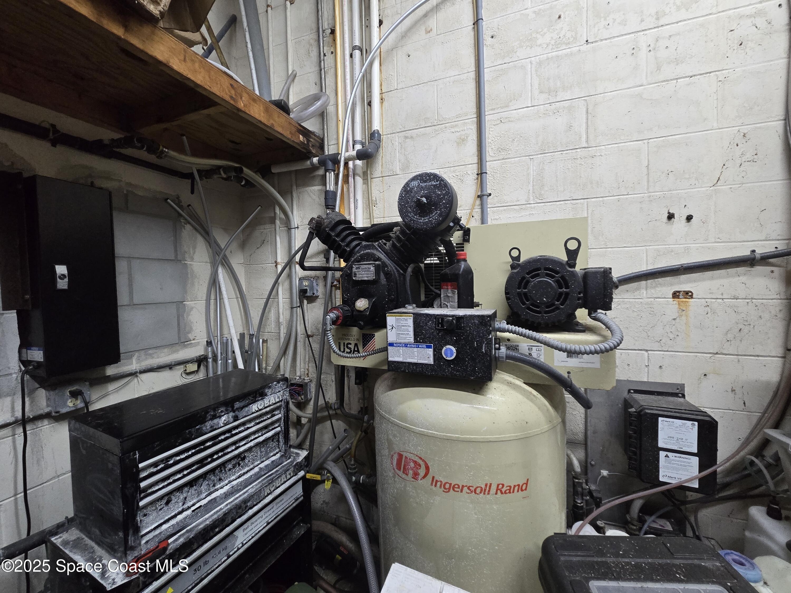 745 South Wickham Road West Melbourne, FL 32904 - Photo 31 of 67 a room with storage and utility