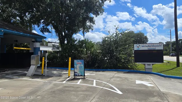 a view of a room with table and chairs
