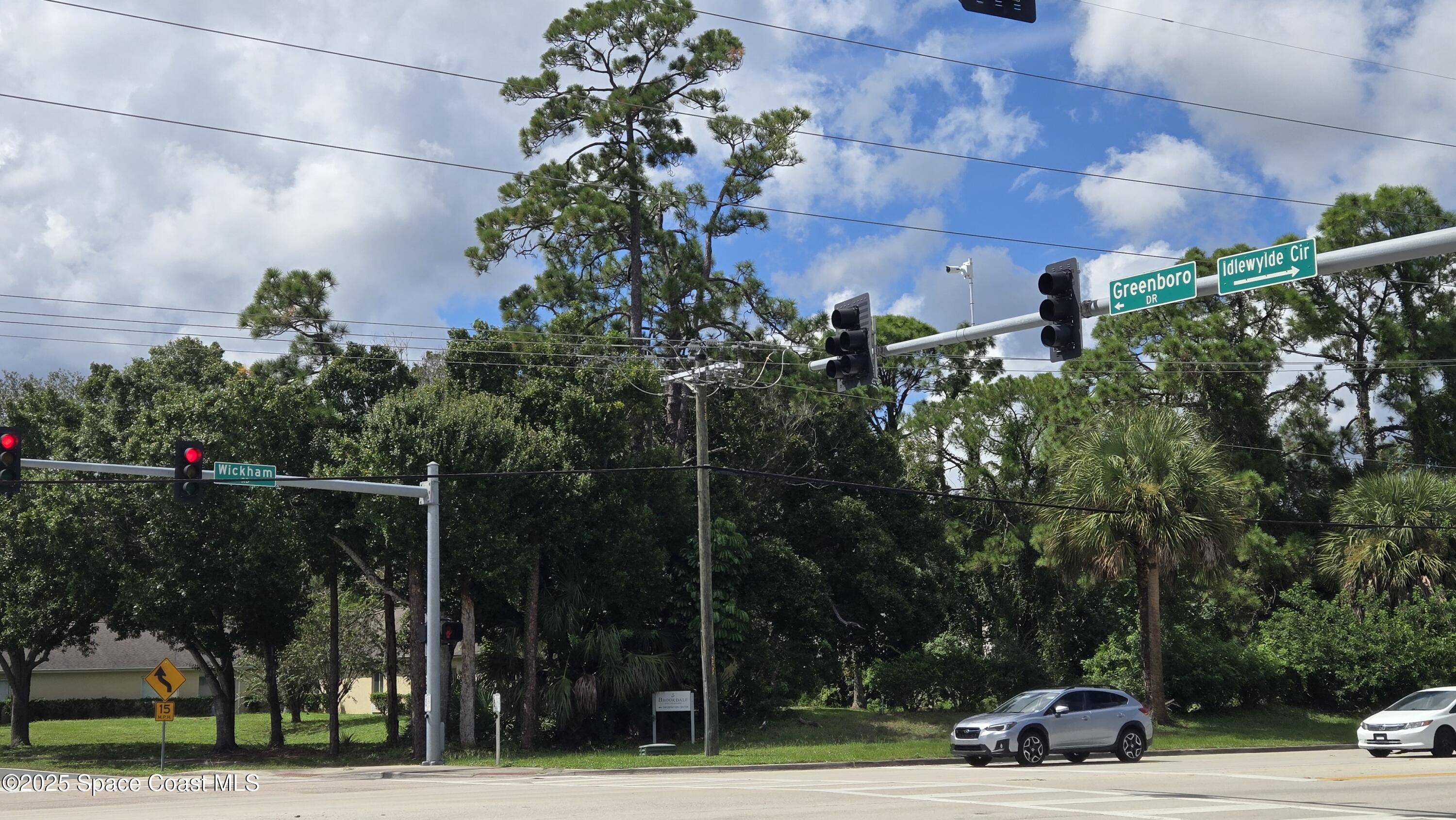 745 South Wickham Road West Melbourne, FL 32904 - Photo 40 of 67 a view of outdoor space with garden and lots of trees