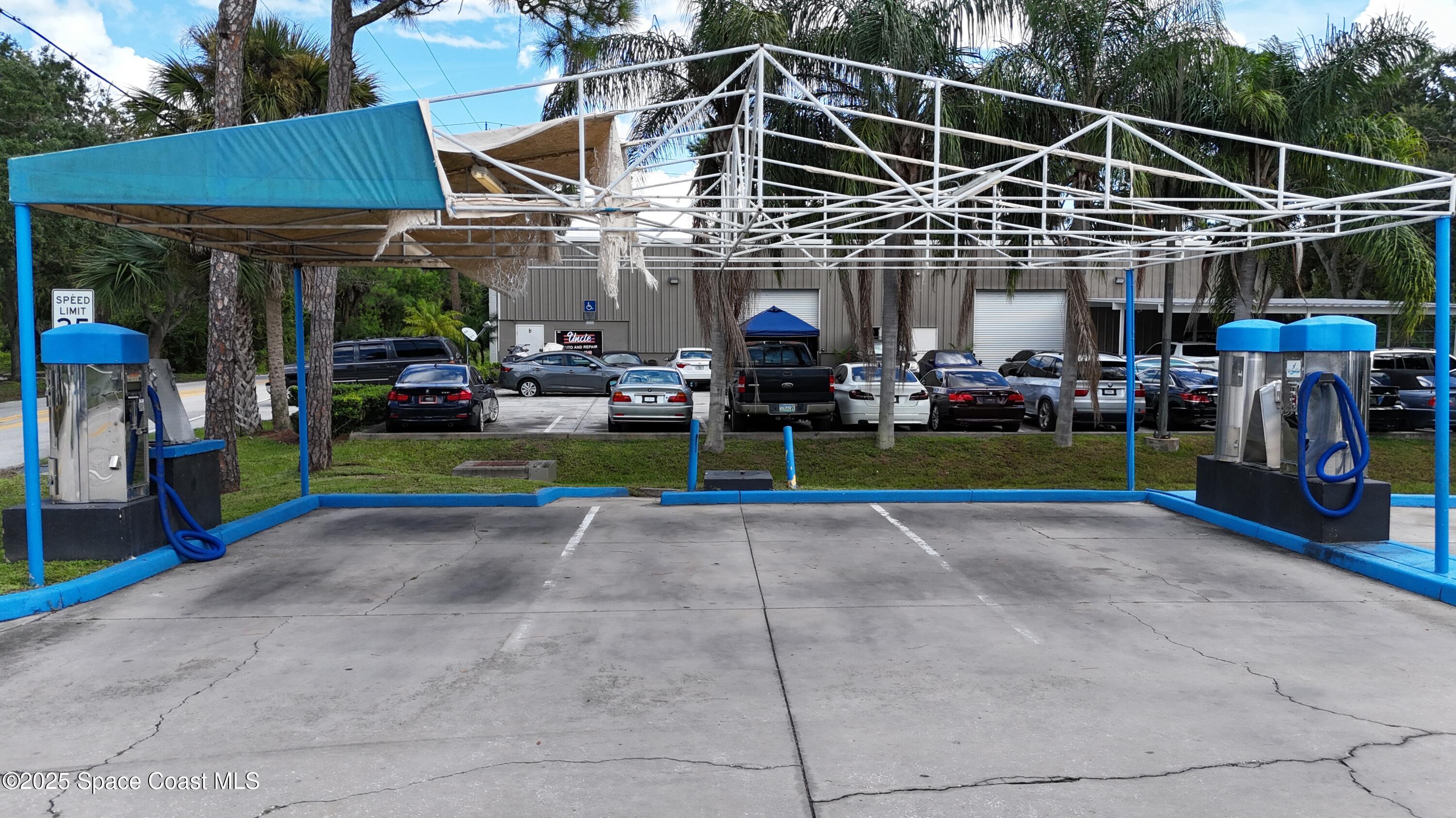 745 South Wickham Road West Melbourne, FL 32904 - Photo 53 of 67 a view of a big room with chairs and table in a patio