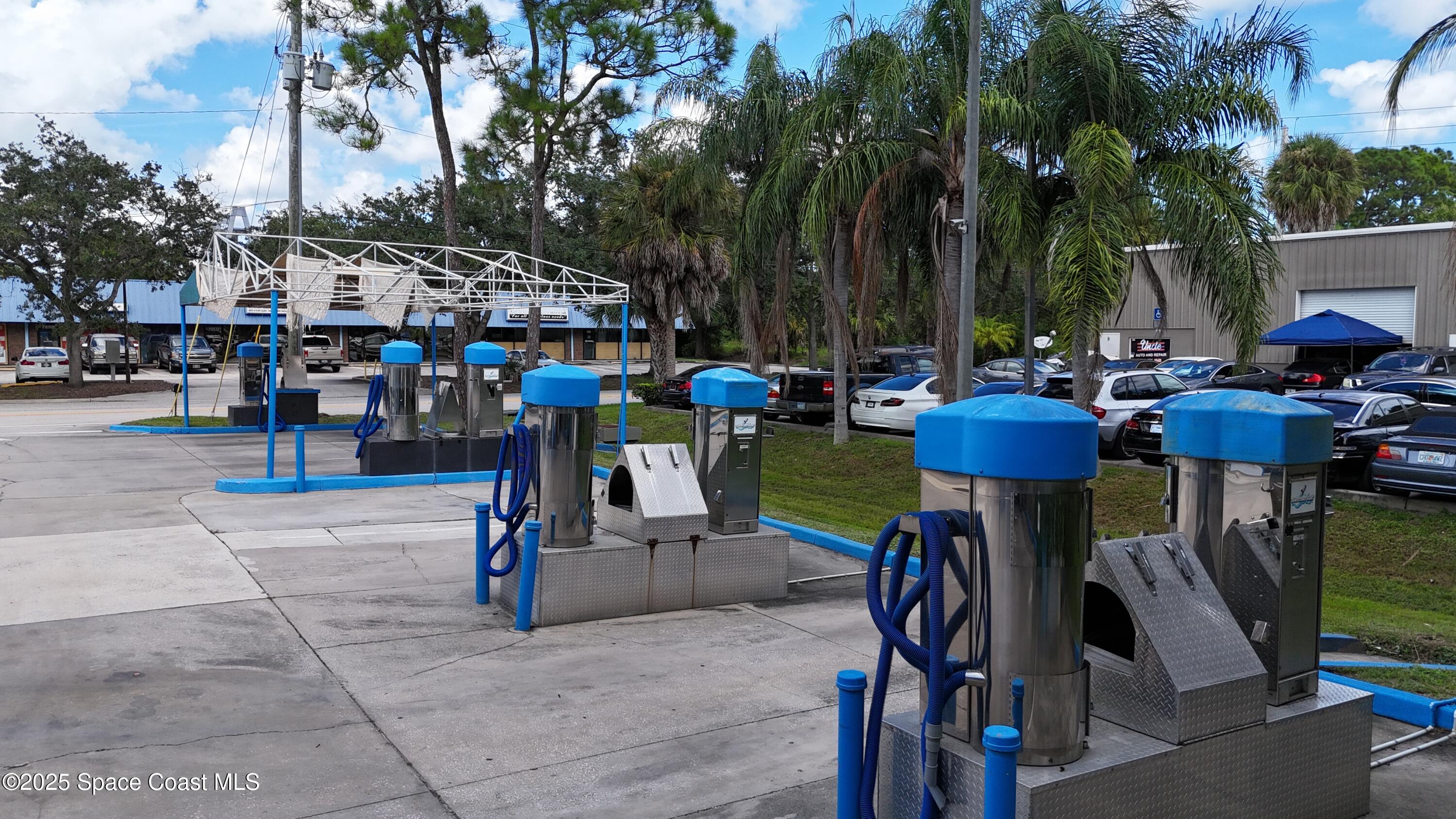 745 South Wickham Road West Melbourne, FL 32904 - Photo 58 of 67 a view of outdoor space with seating area and trees