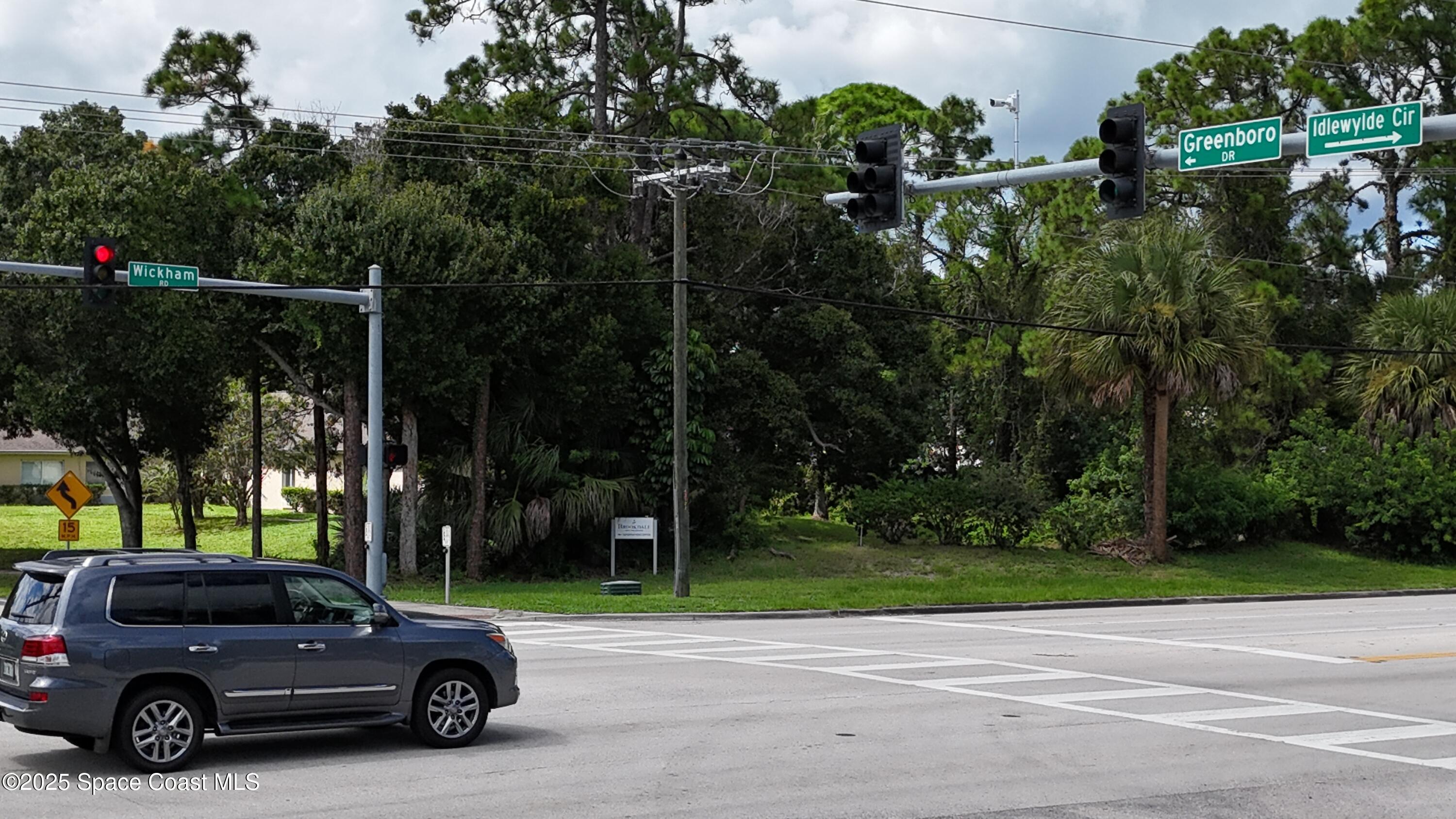 745 South Wickham Road West Melbourne, FL 32904 - Photo 64 of 67 a view of a car parked in front of a house