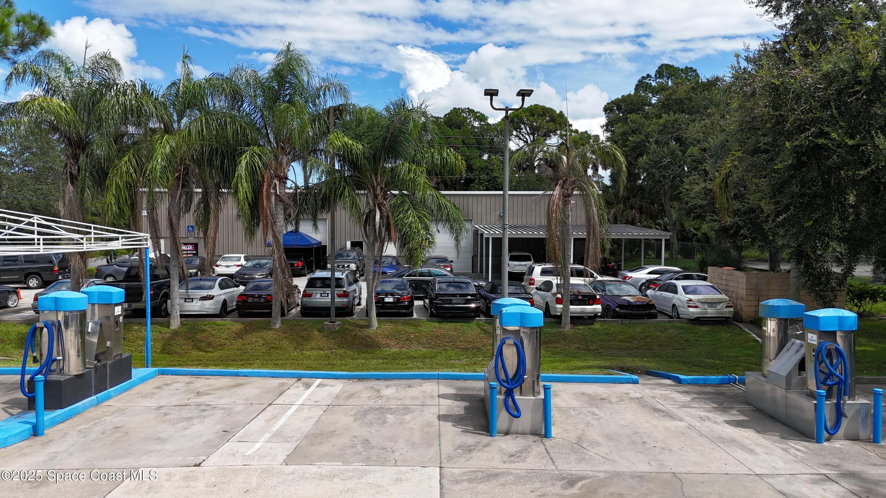 745 South Wickham Road West Melbourne, FL 32904 - Photo 67 of 67 a view of a park with swings and slides
