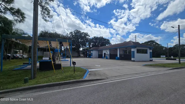 a front view of a building with retail shops