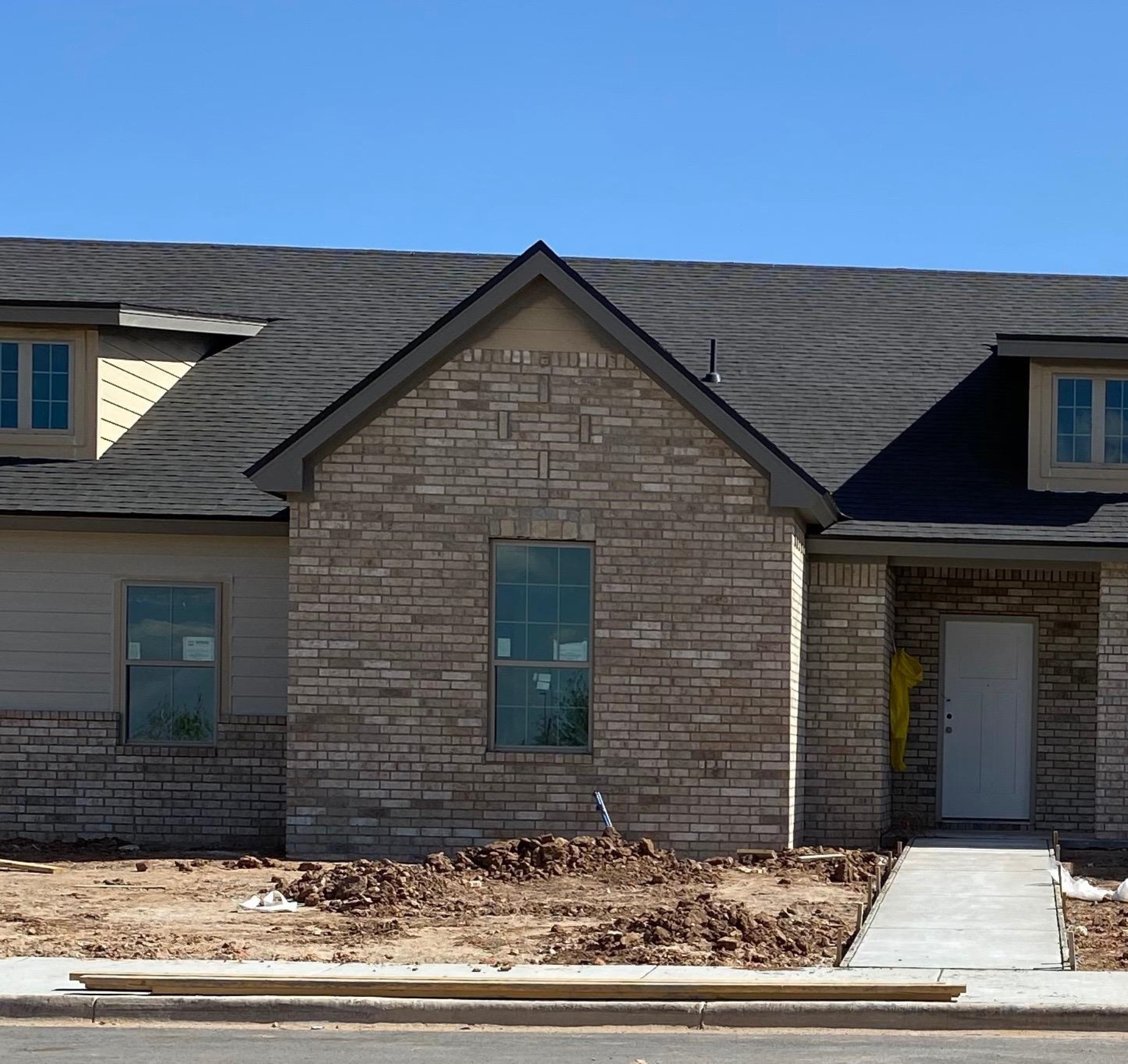 2733 137th Street Lubbock, TX 79423 - Photo 1 of 5 a view of a brick house with a outdoor space