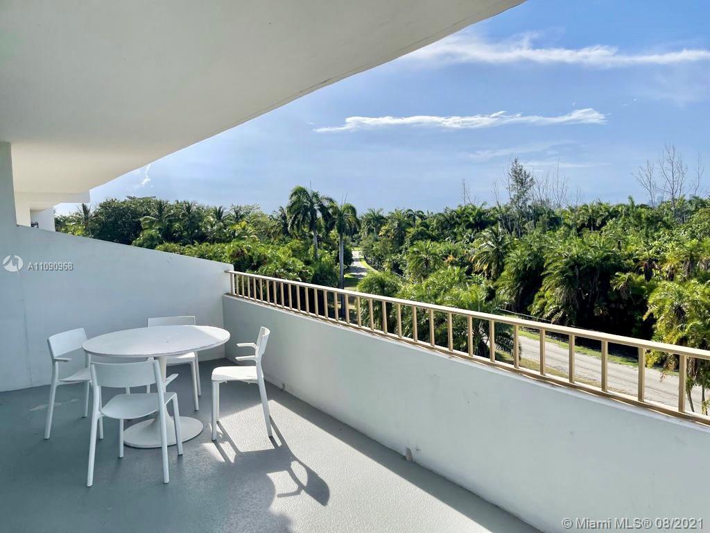 155 Ocean Ln Drive, Unit 414 Key Biscayne, FL 33149 - Photo 3 of 9 a view of a balcony with chairs