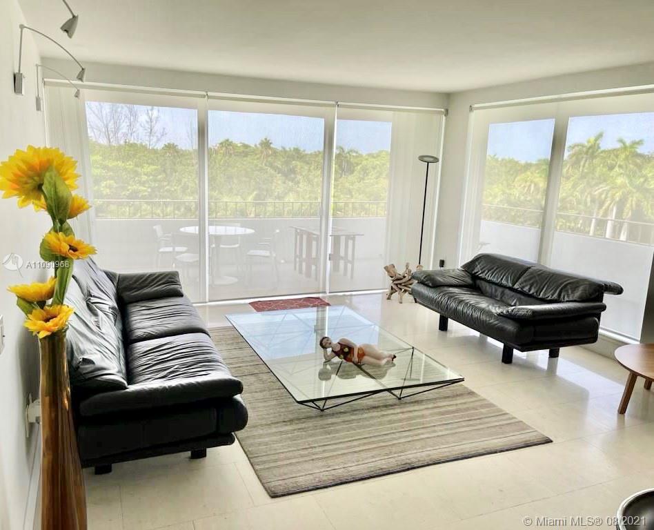 155 Ocean Ln Drive, Unit 414 Key Biscayne, FL 33149 - Photo 6 of 9 a living room with furniture and a large window
